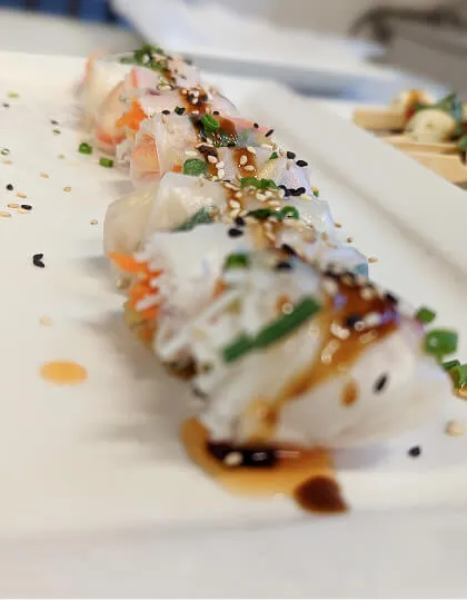 Fresh spring rolls with sesame seeds plated for event catering