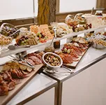 Multi-tier charcuterie and cheese buffet at a catered event